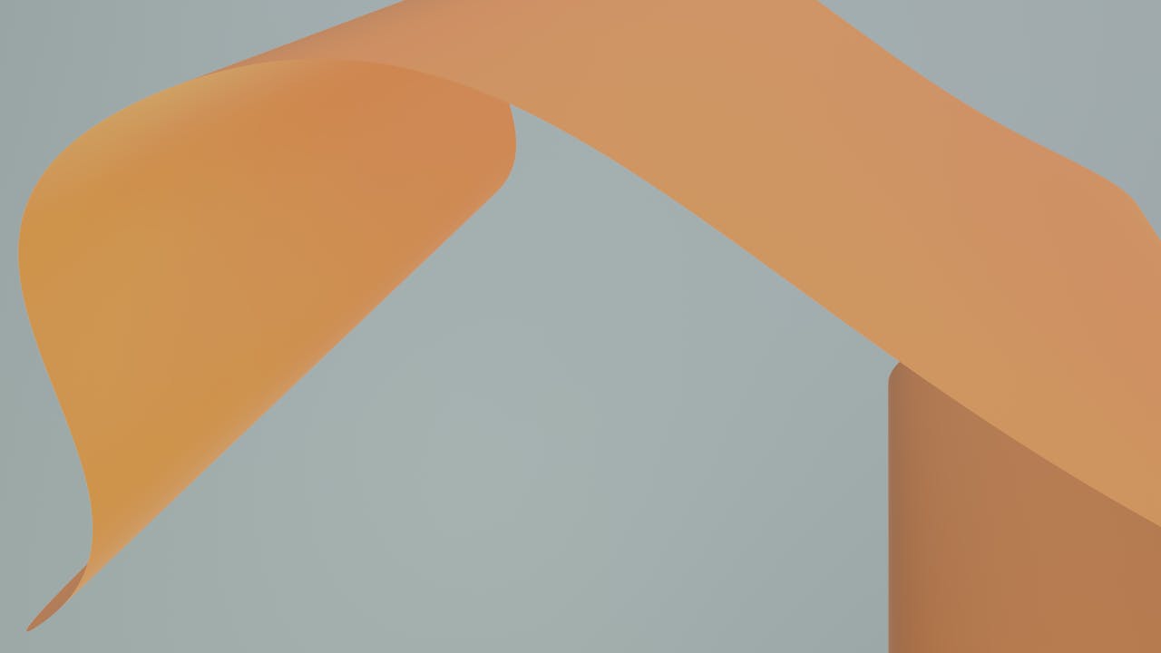 Elegant abstract image featuring orange and grey flowing shapes, ideal for artistic and modern themes.